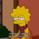 A simpsons character sitting in front of a window.