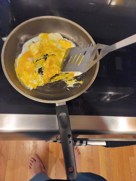 A frying pan with some eggs in it