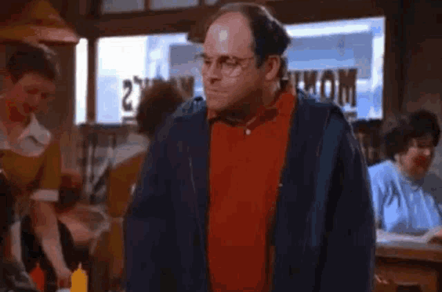 A blurry picture of george costanza in the office